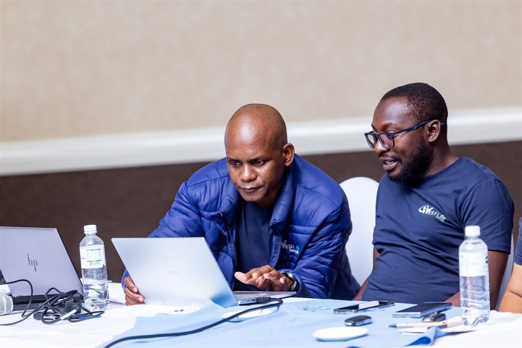 Westlife team members working together during an engagement session